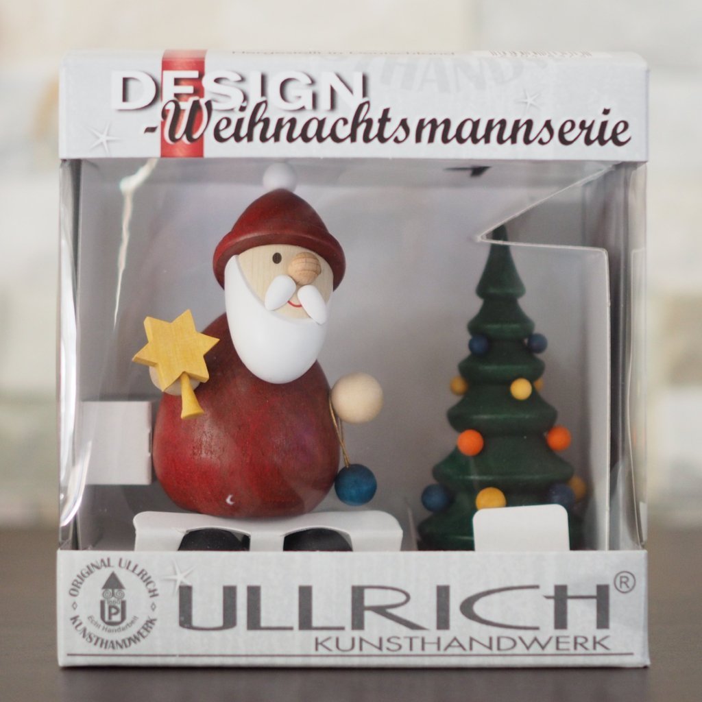 Weihnachtsmann Collectibles - Santa topping his Tree